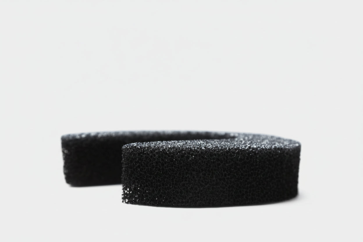 side view of a Hugo Activated Carbon Replacement Filte on a white backround.