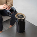 Person putting the Hugo Activated Carbon Replacement Filter into the Hugo 3-in-1 Air Purifier.